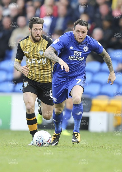 160917 - Cardiff City v Sheffield Wednesday, SkyBet Championship - Lee Tomlin of Cardiff City is challenged by Jacob Butterfield of Sheffield Wednesday