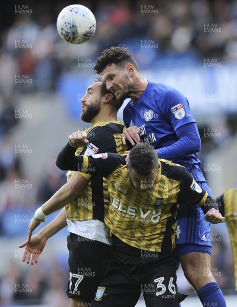 160917 - Cardiff City v Sheffield Wednesday, SkyBet Championship - Sean Morrison of Cardiff City gets above Atdhe Nuhiu of Sheffield Wednesday and Daniel Pudil of Sheffield Wednesday