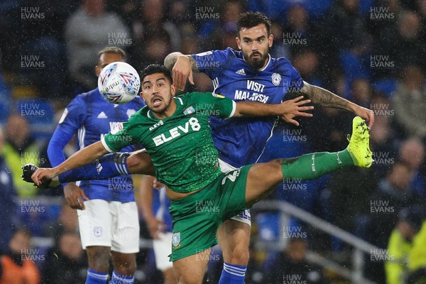 181019 - Cardiff City v Sheffield Wednesday, Sky Bet Championship - Marlon Pack of Cardiff City and and Massimo Luongo of Sheffield Wednesday compete for the ball