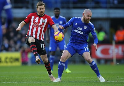 081218 - Cardiff City v Southampton, Premier League - Aron Gunnarsson of Cardiff City and Stuart Armstrong of Southampton compete for the ball