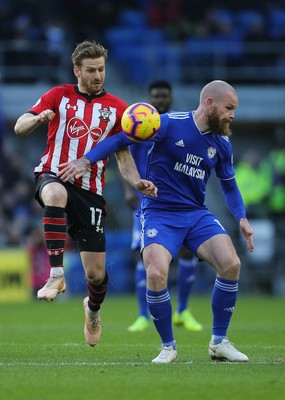 081218 - Cardiff City v Southampton, Premier League - Aron Gunnarsson of Cardiff City and Stuart Armstrong of Southampton compete for the ball