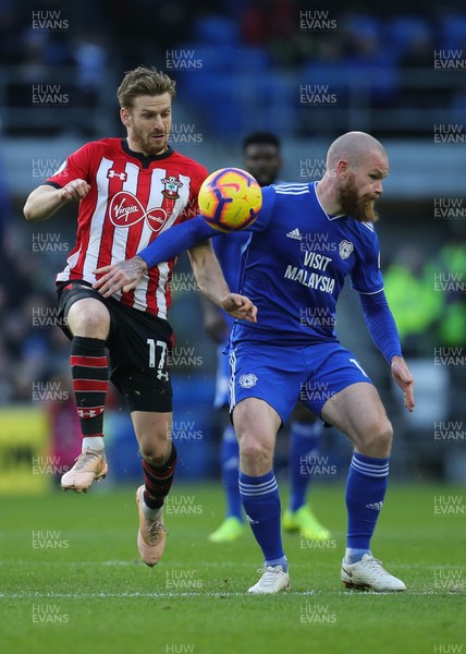 081218 - Cardiff City v Southampton, Premier League - Aron Gunnarsson of Cardiff City and Stuart Armstrong of Southampton compete for the ball
