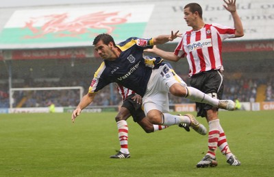 09.08.08 -  Cardiff City v Southampton, Coca Cola Championship -  Cardiff's Joe Ledley is brought down by Southampton's Lloyd James   