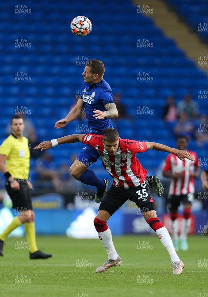 270721 - Cardiff City v Southampton, Pre-season Friendly - James Collins of Cardiff City and Jan Bednarek of Southampton compete for the ball