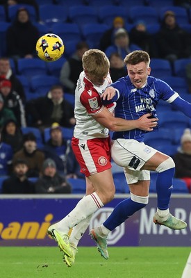 291225 - Cardiff City v Stevenage, EFL Sky Bet League 1 - Isaak Davies of Cardiff City heads at goal as Carl Piergianni of Stevenage challenges