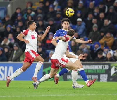 291225 - Cardiff City v Stevenage, EFL Sky Bet League 1 - Yousef Salech of Cardiff City takes on Luther James-Wildin of Stevenage and Charlie Goode of Stevenage