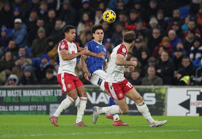 291225 - Cardiff City v Stevenage, EFL Sky Bet League 1 - Yousef Salech of Cardiff City takes on Luther James-Wildin of Stevenage and Charlie Goode of Stevenage