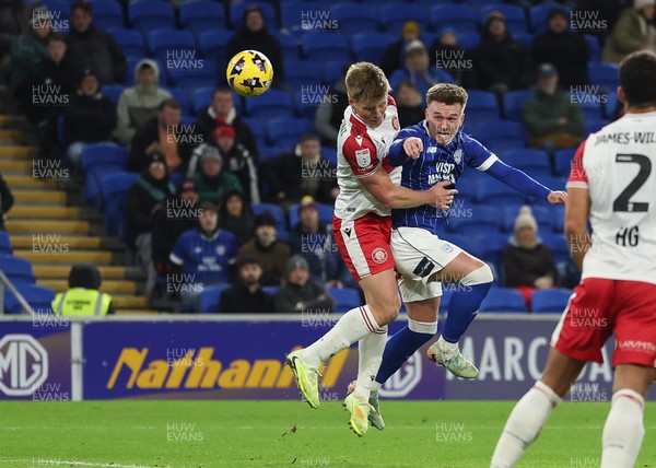 291225 - Cardiff City v Stevenage, EFL Sky Bet League 1 - Isaak Davies of Cardiff City heads at goal as Carl Piergianni of Stevenage challenges