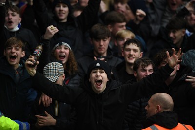 240126 - Cardiff City v Stockport County - Sky Bet League 1 - Stockport fans celebrate after their side scores the first goal of the game