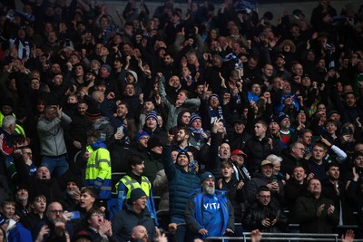 240126 - Cardiff City v Stockport County - Sky Bet League 1 - Stockport fans celebrate after their side scores the first goal of the game