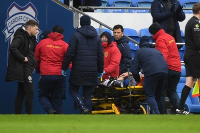240126 - Cardiff City v Stockport County - Sky Bet League 1 - Yousef Salech of Cardiff City is stretchered off after picking up an injury