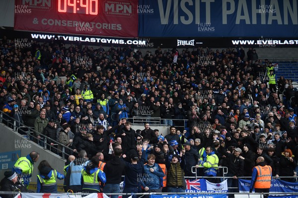 240126 - Cardiff City v Stockport County - Sky Bet League 1 - Stockport fans celebrate after their side scores the first goal of the game