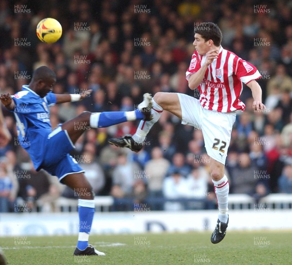 110206 - Cardiff City v Stoke City Stoke's Lewis Buxton and Guylain Ndumbu Nsungu compete 