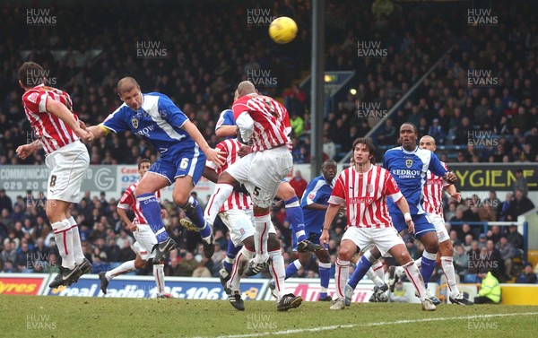 110206 - Cardiff City v Stoke City Neil Cox (6) heads the ball to claim Cardiff's third goal 