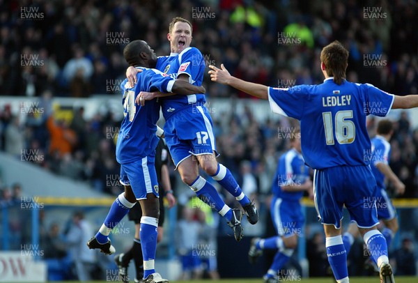 110206Cardiff City v Stoke Cardiff's Kevin Cooper celebrates his goal with Guylain Ndumbu Nsungu and Joe Ledley 