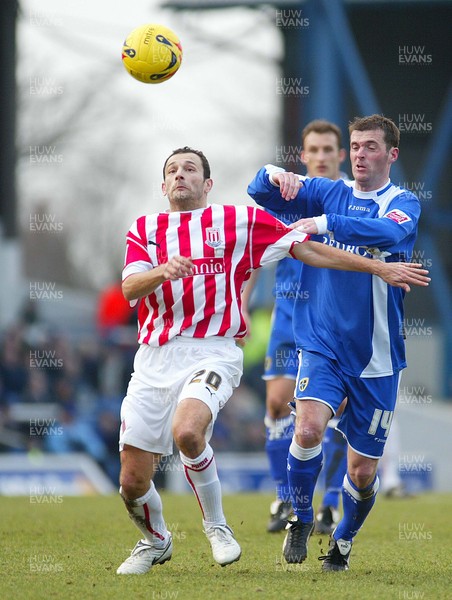 110206Cardiff City v Stoke Stokes Josip Skoko holds off Willie Boland 