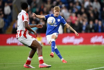 080926 - Cardiff City v Stoke City - Sky Bet Championship - Joel Bagan of Cardiff City is challenged by Ben Johnson of Stoke