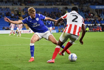 080926 - Cardiff City v Stoke City - Sky Bet Championship - Joel Bagan of Cardiff City is challenged by Ben Johnson of Stoke