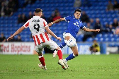 080926 - Cardiff City v Stoke City - Sky Bet Championship - Alex Robertson of Cardiff City is challenged by Robert Bozenik of Stoke