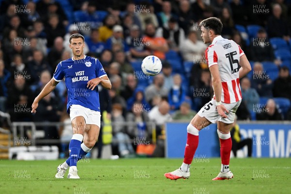 080926 - Cardiff City v Stoke City - Sky Bet Championship - Krystian Bielik of Cardiff City is challenged by George Hirst of Stoke