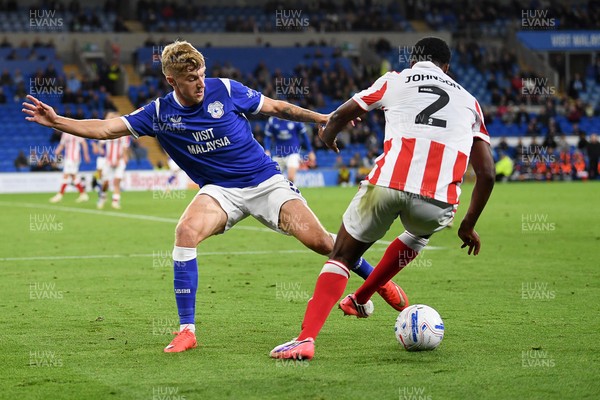 080926 - Cardiff City v Stoke City - Sky Bet Championship - Joel Bagan of Cardiff City is challenged by Ben Johnson of Stoke