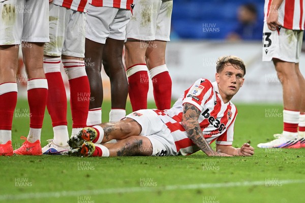 080926 - Cardiff City v Stoke City - Sky Bet Championship - Ethan Galbraith of Stoke led down  in the wall