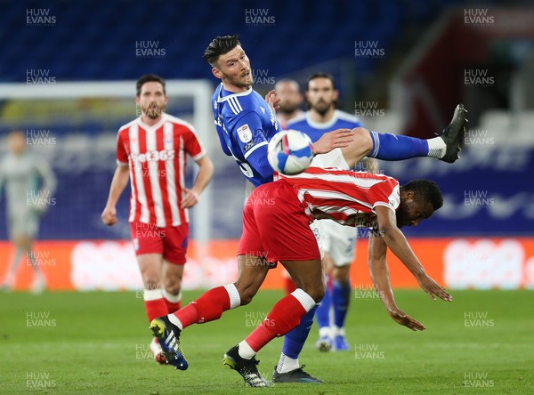 160321 Cardiff City v Stoke City, Sky Bet Championship - Kieffer Moore of Cardiff City and John Obi Mikel of Stoke City compete for the ball