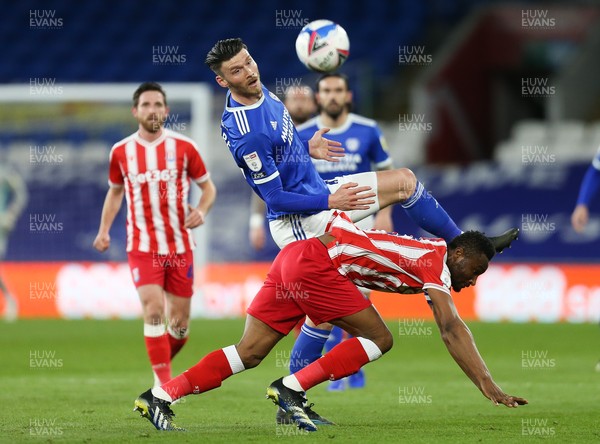 160321 Cardiff City v Stoke City, Sky Bet Championship - Kieffer Moore of Cardiff City and John Obi Mikel of Stoke City compete for the ball