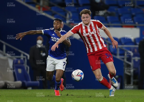 160321 Cardiff City v Stoke City, Sky Bet Championship - Leandro Bacuna of Cardiff City and Harry Souttar of Stoke City compete for the ball