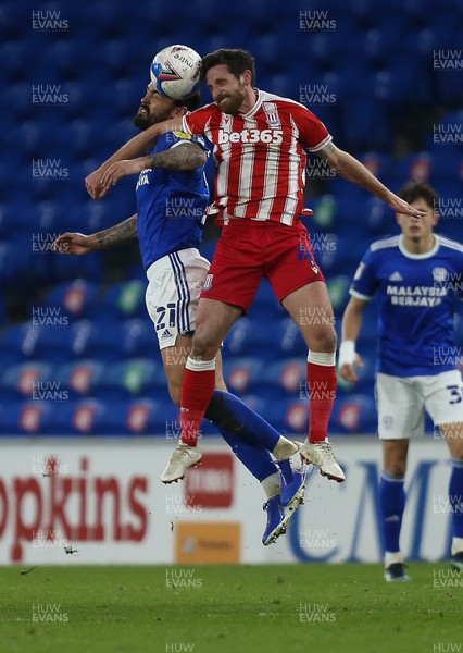 160321 Cardiff City v Stoke City, Sky Bet Championship - Marlon Pack of Cardiff City and Joe Allen of Stoke City compete for the ball