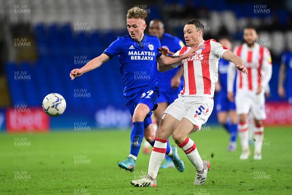 160322 - Cardiff City v Stoke City - Sky Bet Championship - Isaak Davies of Cardiff City vies for possession with James Chester of Stoke City 