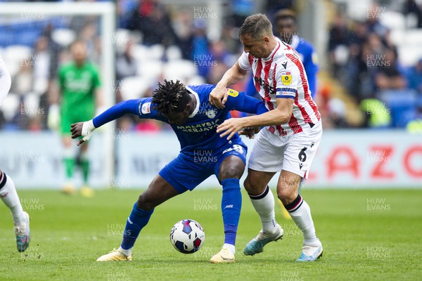 220423 - Cardiff City v Stoke City - Sky Bet Championship - Sory Kaba of Cardiff City in action against Phil Jagielka of Stoke City