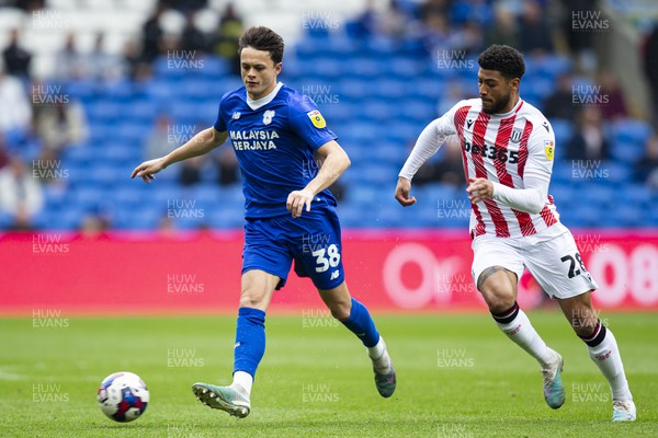 220423 - Cardiff City v Stoke City - Sky Bet Championship - Perry Ng of Cardiff City in action against Josh Laurent of Stoke City