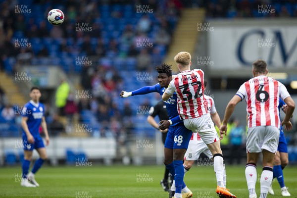 220423 - Cardiff City v Stoke City - Sky Bet Championship - Sory Kaba of Cardiff City in action against Connor Taylor of Stoke City