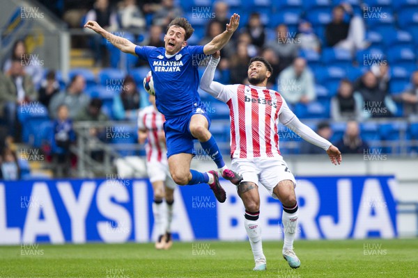 220423 - Cardiff City v Stoke City - Sky Bet Championship - Ryan Wintle of Cardiff City in action against Josh Laurent of Stoke City