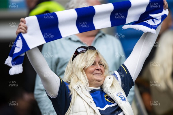 220423 - Cardiff City v Stoke City - Sky Bet Championship - A Cardiff City fan waves her scarf ahead of kick off