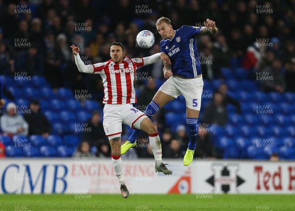 261119 - Cardiff City v Stoke City, Sky Bet Championship - Aden Flint of Cardiff City and Lee Gregory of Stoke City compete for the ball