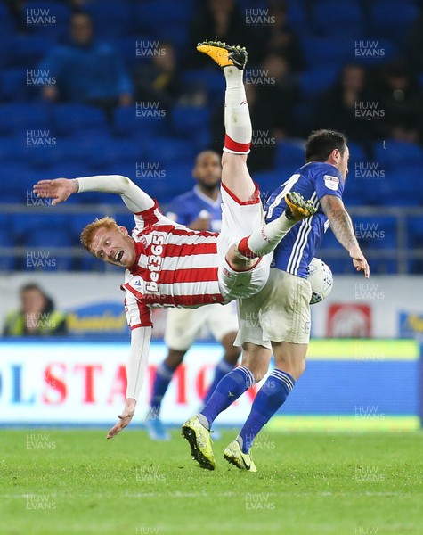 261119 - Cardiff City v Stoke City, Sky Bet Championship - Ryan Woods of Stoke City is upended during a challenge from Lee Tomlin of Cardiff City