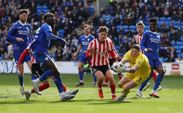 100423 - Cardiff City v Sunderland - SkyBet Championship - Anthony Patterson of Sunderland gets to the ball before Cedric Kipre of Cardiff City 