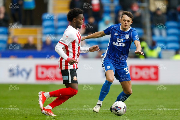 290324 - Cardiff City v Sunderland - Sky Bet Championship - Abdoullah Ba of Sunderland and Perry Ng of Cardiff City