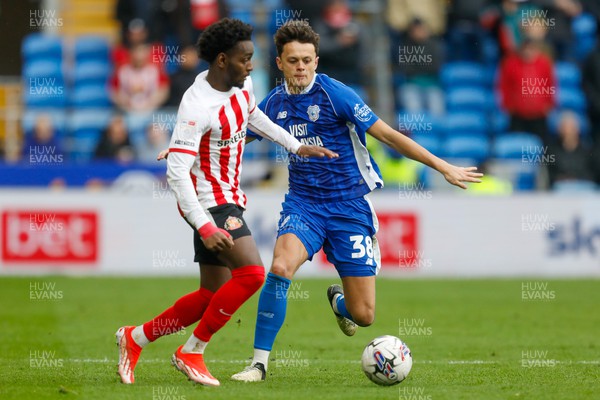 290324 - Cardiff City v Sunderland - Sky Bet Championship - Perry Ng of Cardiff City and Abdoullah Ba of Sunderland