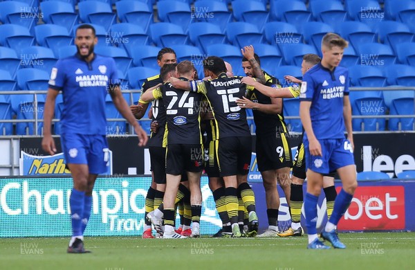 100821 - Cardiff City v Sutton United, EFL Carabao Cup - Sutton United players celebrate with Donovan Wilson of Sutton United after he scores the opening goal after 4 minutes