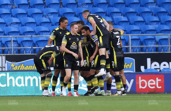 100821 - Cardiff City v Sutton United, EFL Carabao Cup - Sutton United players celebrate with Donovan Wilson of Sutton United after he scores the opening goal after 4 minutes
