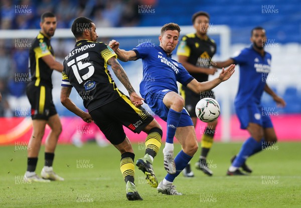 100821 - Cardiff City v Sutton United, EFL Carabao Cup - Ryan Wintle of Cardiff City and Craig Eastmond of Sutton United compete for the ball