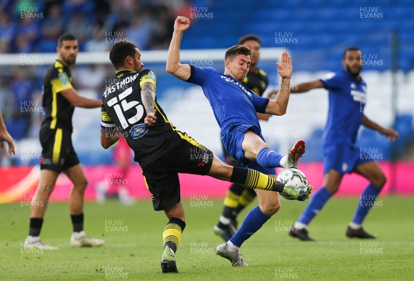 100821 - Cardiff City v Sutton United, EFL Carabao Cup - Ryan Wintle of Cardiff City and Craig Eastmond of Sutton United compete for the ball