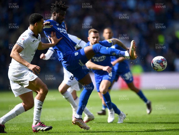 010423 - Cardiff City v Swansea City - EFL SkyBet Championship - Cedric Kipre of Cardiff City is tackled by Ben Cabango of Swansea City