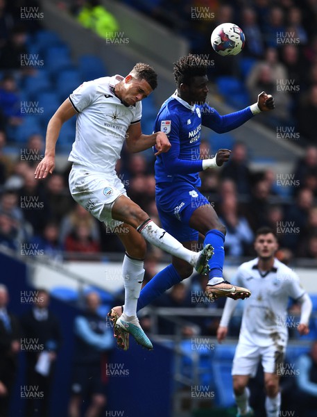 010423 - Cardiff City v Swansea City - EFL SkyBet Championship - Sory Kaba of Cardiff City and Nathan Wood of Swansea City compete in the air