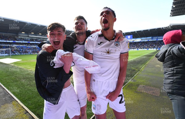 010423 - Cardiff City v Swansea City - EFL SkyBet Championship - Luke Cundle, Liam Cullen and Nathan Wood of Swansea City celebrates win