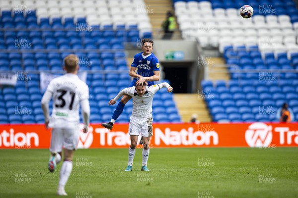 010423 - Cardiff City v Swansea City - Sky Bet Championship - Perry Ng of Cardiff City wins a header against Liam Cullen of Swansea City
