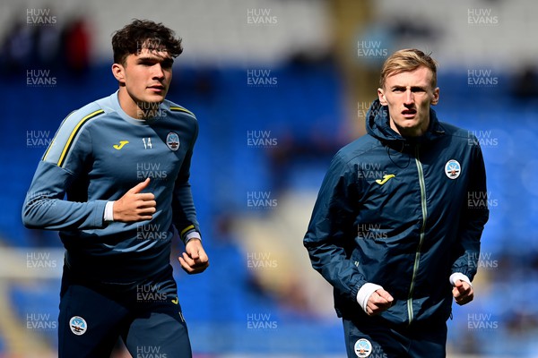 020422 - Cardiff City v Swansea City - Sky Bet Championship - Kyle Joseph of Swansea City and Flynn Downes of Swansea City during the pre-match warm-up 